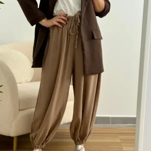 Pantalón bombacho puño beige | Olivia