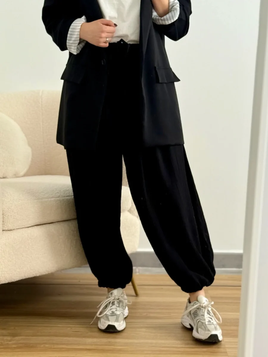 Pantalón bombacho puño negro| Olivia